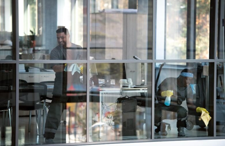 full-shot-smiley-man-cleaning-window (1)